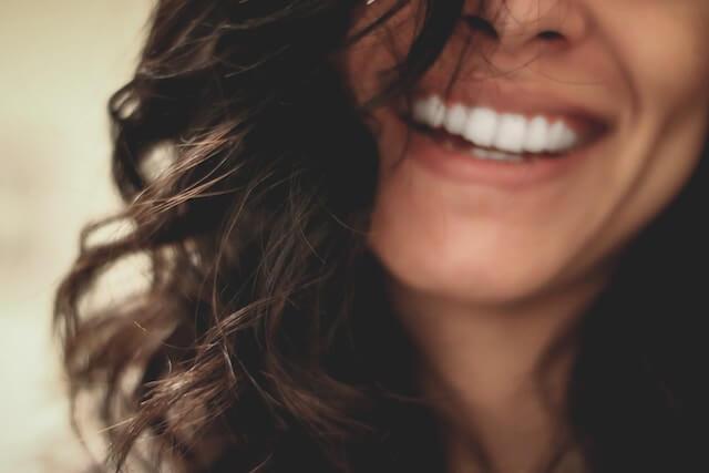 close-up shot of a woman's smile